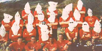 The picture that caused the row: Australian soldiers at Townsville's Lavarack barracks dressed as members of the Ku Klux Klan.