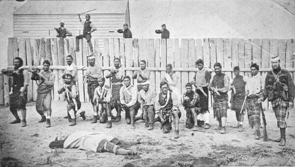 Thomas William Porter (right) and pro-Government Maori troops outside a stockade, 1870