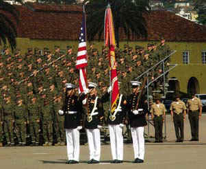 The Battle Colors of the Marine Corps are proudly displayed.  The Marine Corps flag is adorned with battle streamers that represent over 400 battles and awards. Photo by: Lance Cpl. Jess N. Levens